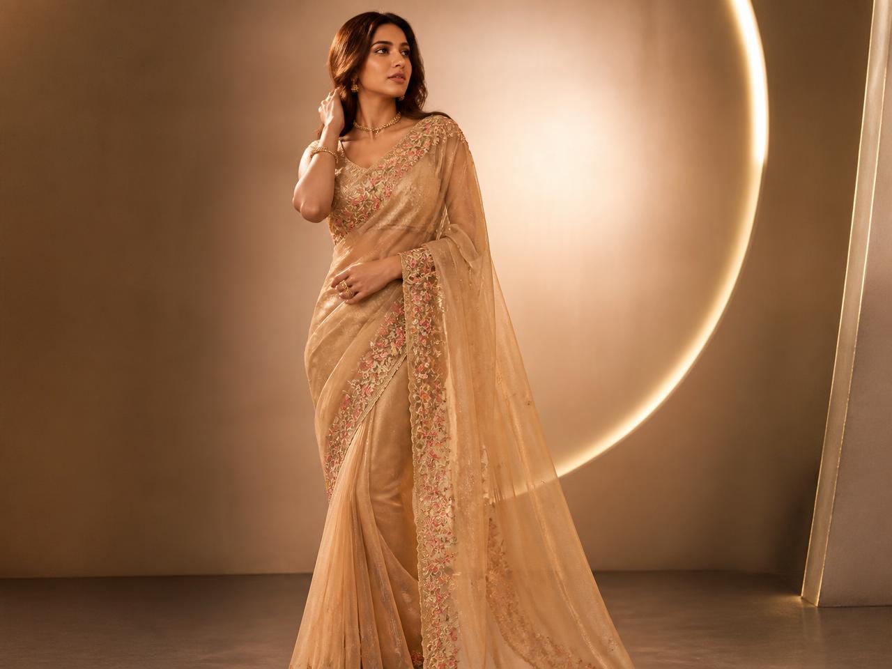 Model in a golden tissue saree